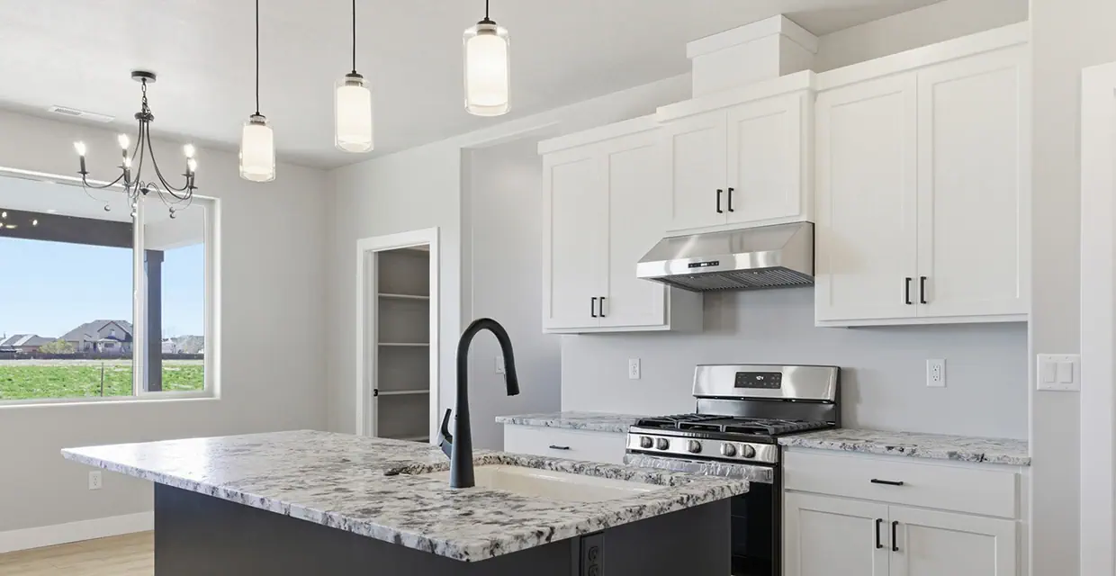 Westview Ridge kitchen island with pendant lights, walk-in pantry and a 7-foot picture window looking out over Cedar City